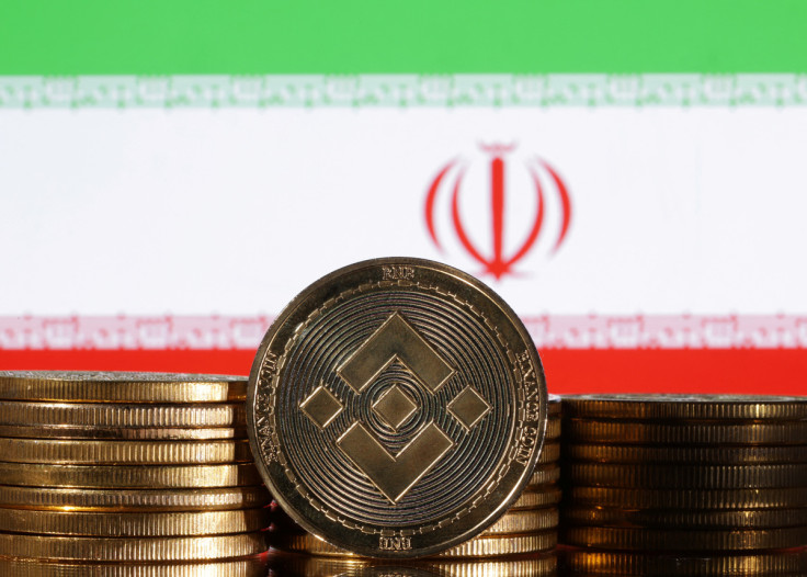 Illustration shows representations of cryptocurrency Binance and Iran flag