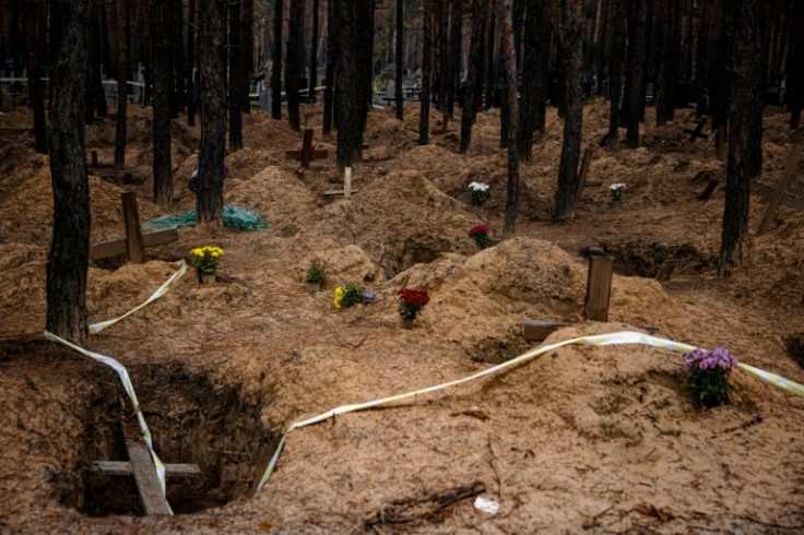 Hundreds of bodies were exhumed from mass graves found near the Ukrainian city of Izyum