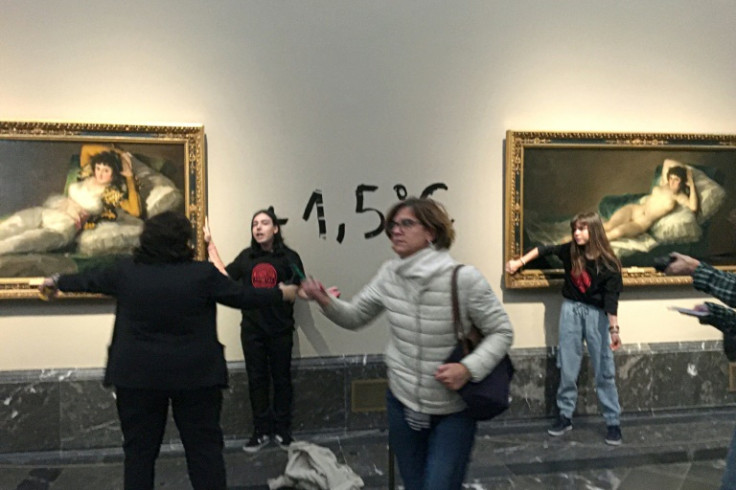 Two climate activists were detained after each glued a hand to a painting in the Madrid museum