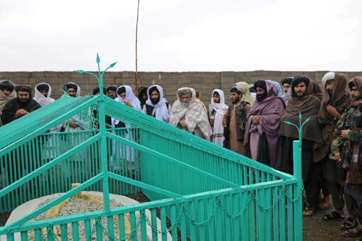 The Taliban released handout pictures of a ceremony held at the newly revealed gravesite of the movement's founder, Mullah Omar