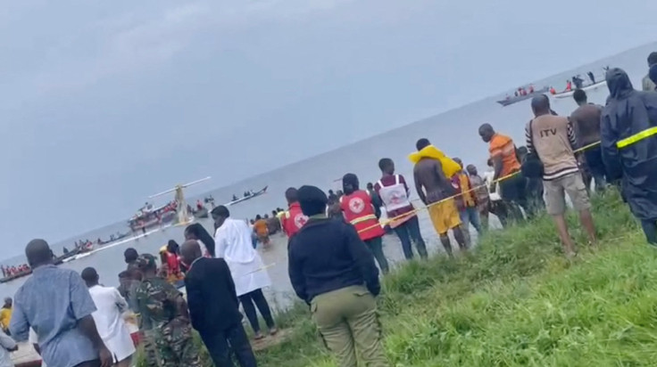 People look at Precision Air plane that crushed into Lake Victoria
