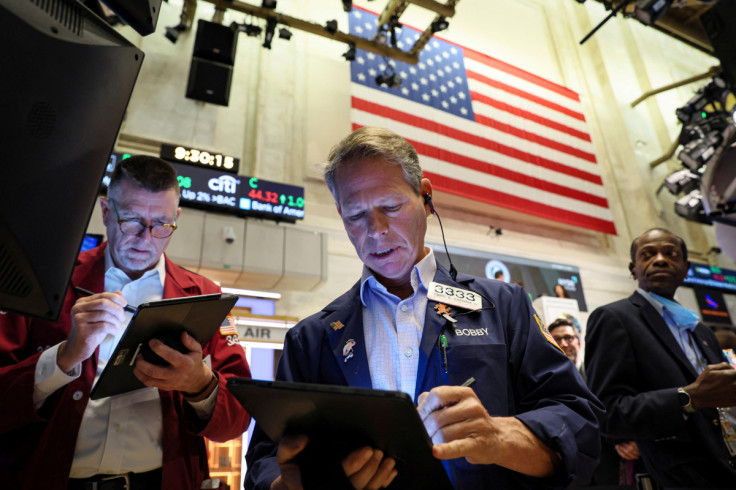 Traders work on the floor of the NYSE in New York