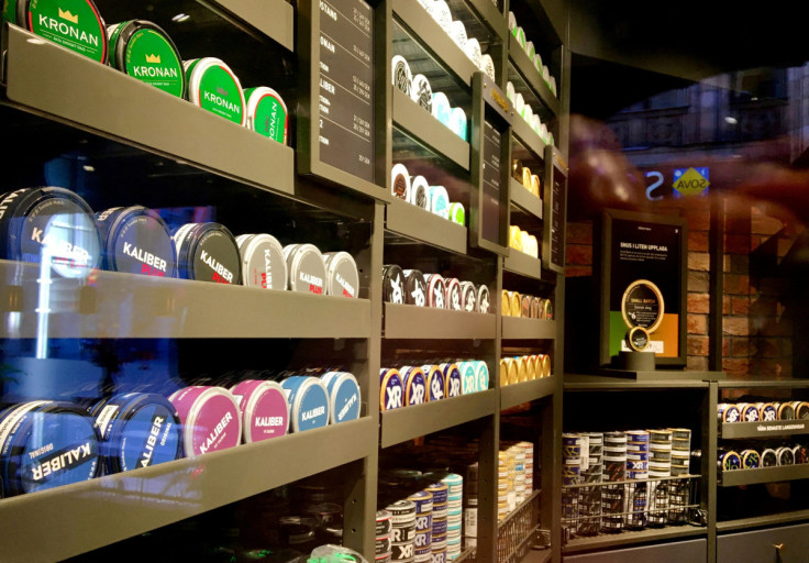 Moist powder tobacco "snus" cans are seen on shelves at a Swedish Match store in Stockholm