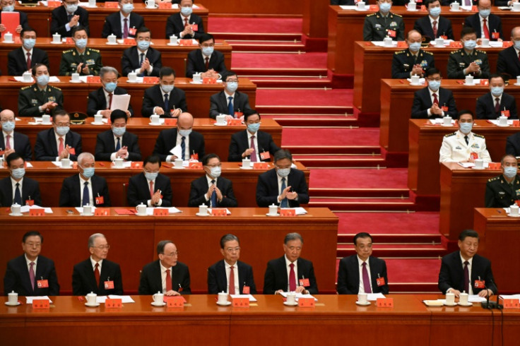 China's President Xi Jinping (bottom R) was given an unprecedented third term as Communist leader by a party congress last month
