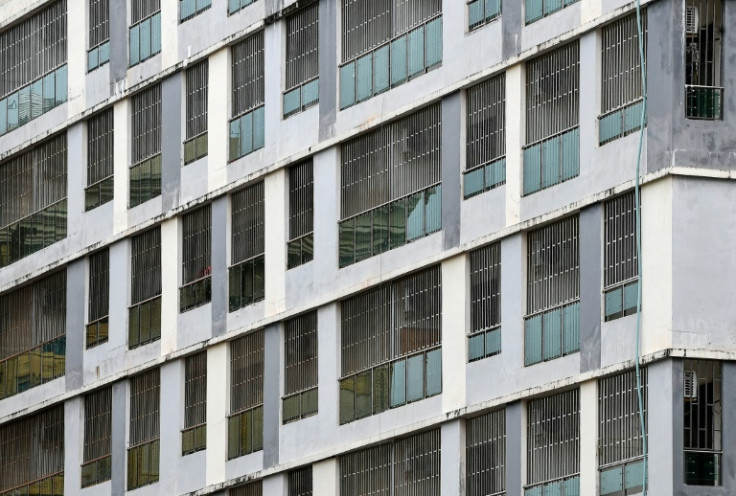 Steel bars cover the windows of empty buildings inside the Chinatown district in Sihanoukville in Preah Sihanouk province