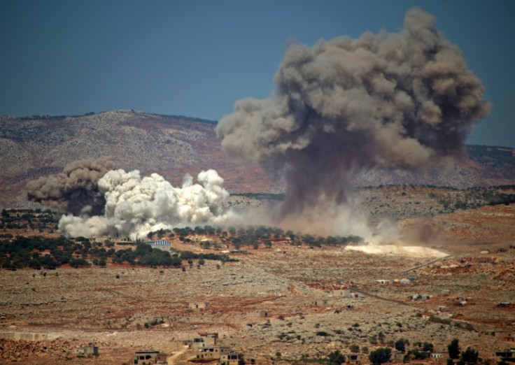 Plumes of smoke rise during a reported Russian bombing in Syria near the village of Hafsarja, in the rebel-held Idlib region, on September 8, 2022