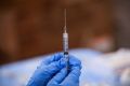 A syringe is filled with a dose of Pfizer's coronavirus disease (COVID-19) vaccine  at a pop-up community vaccination center in Valley Stream, New York