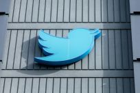 Twitter users can click a profile's badge to see whether the account paid for it