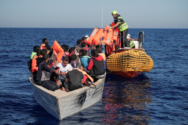 Italy lets in migrants from German boat, other ships still waiting