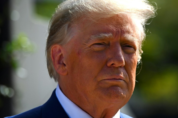 Former US president Donald Trump speaks to the media after voting in the US midterm elections in Palm Beach, Florida on November 8, 2022