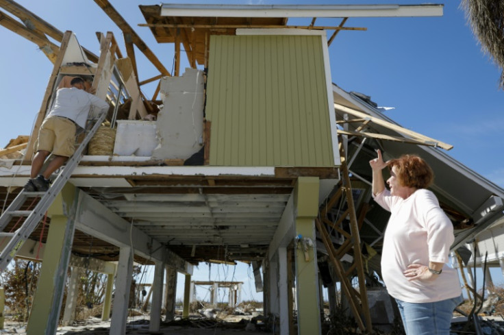 Homeowner Patty Kulkin looks at the wreckage caused by Hurricane Ian