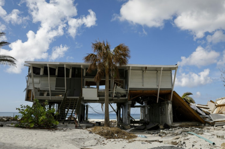 A wrecked beach house awaits reconstruction at Bonita Beach, Florida