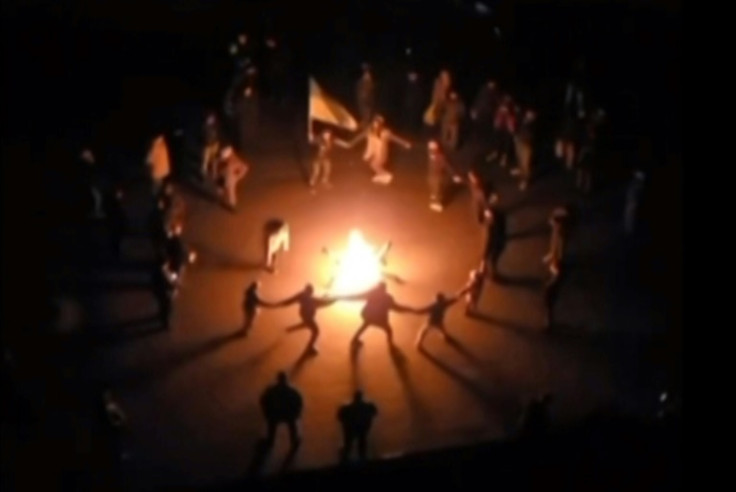 Ukrainians in Kherson danced around a bonfire in darkness and sang 'Chervona Kalyna', a patriotic song