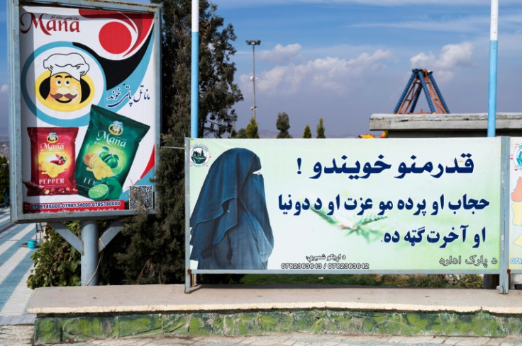 A poster near Zazai Park  in Kabul reads: 'Dear sisters! Hijab and veil are your dignity and are in your benefit in this world and in the hereafter'
