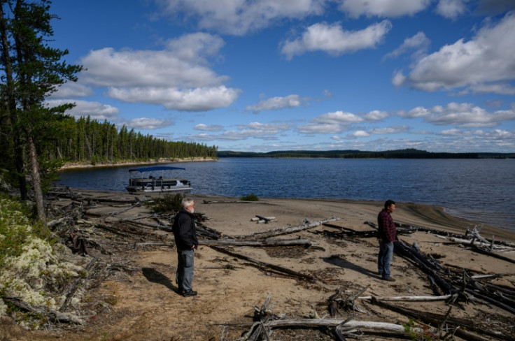 Research scientist Louis De Grandpre (left) walks with indigenous Innu caribou researcher Jean-Luc Kanape (right)