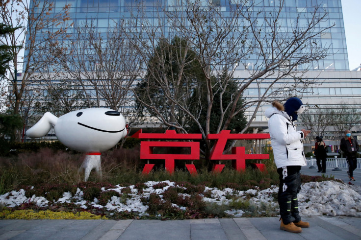 A man stands outside JD.com’s headquarters, amid the Singles' Day shopping festival, during an organised tour in Beijing, China,