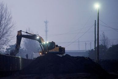 Excavator loads coal to a train in Pingdingshan