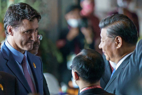 Canada's Prime Minister Justin Trudeau speaks with China's President Xi Jinping at the G20 Leaders' Summit in Bali