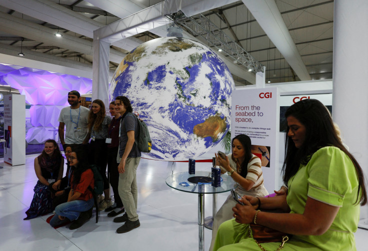 Attendees pose for a photo during the COP27 climate summit in Sharm el-Sheikh, Egypt