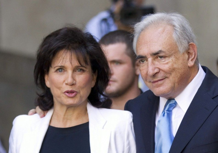 Dominique Strauss-Kahn and his wife Anne Sinclair depart a hearing at the New York State Supreme Courthouse in New York