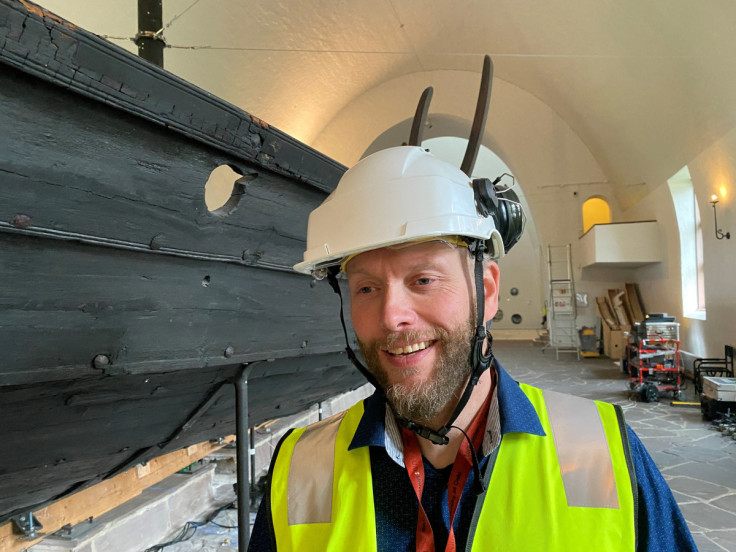Head engineer David Hauer stands in front of the Gokstad ship inside The Viking Ship Museum in Oslo