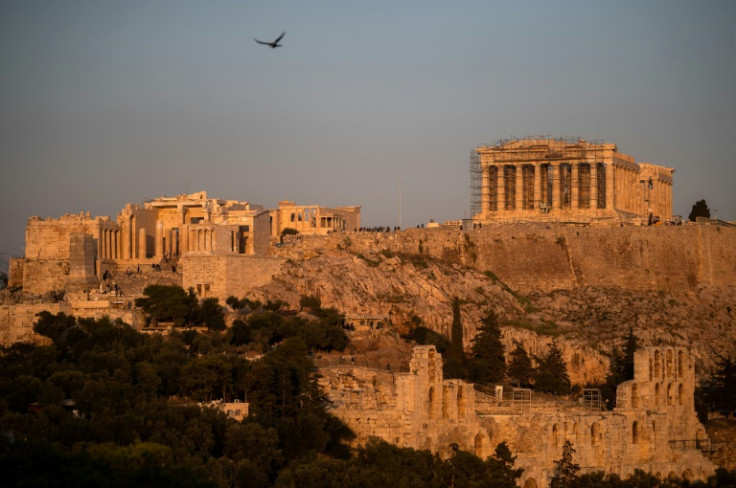 The Parthenon Temple sits atop the Acropolis hill in Athens