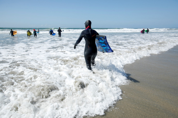 Senior women gather to boogie board on International Women's Day in Solana Beach, California