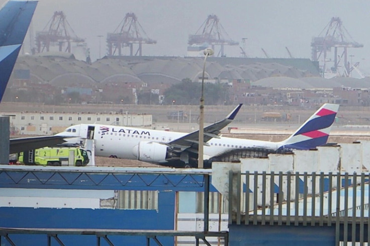 Flight LA2213 is seen after it collided with a fire fighting vehicle at the Jorge Chavez International Ariport in Lima on November 18, 2022