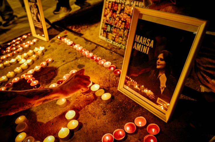 Iranian refugees and Iranians living in Greece lit candles forming the name 'Mahsa' during a demonstration to commemorate 40 days from the death of Mahsa Amini while in police custody in Iran