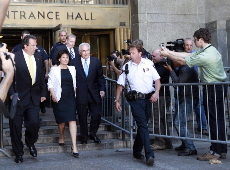 Dominique Strauss-Kahn and his wife Anne Sinclair depart a hearing at the New York State Supreme Courthouse in New York