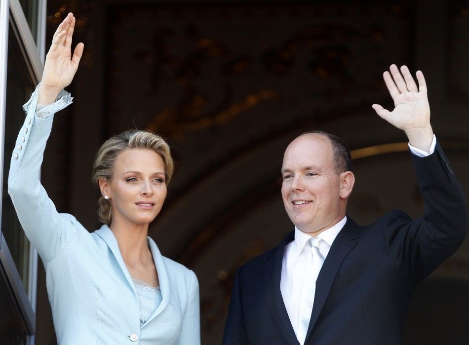 Newlyweds Prince Albert II of Monaco and Princess Charlene wave on the Palace balcony after the civil wedding service in Monaco