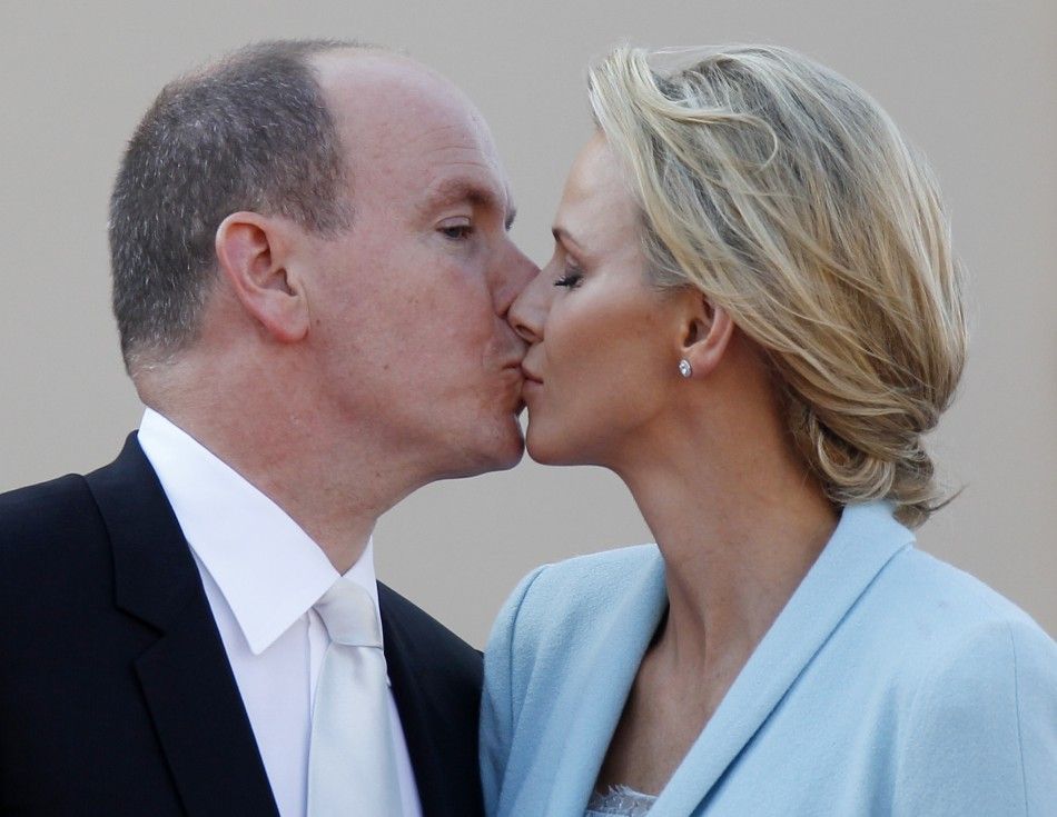  Newlyweds Prince Albert II of Monaco and Princess Charlene kiss on the Palace square after the civil wedding service in Monaco