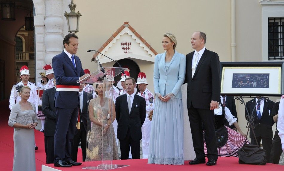  The Mayor of Monaco Georges Marsen speaks to the Prince Albert II of Monaco and Princess Charlene as they receive presents from the Monegasques