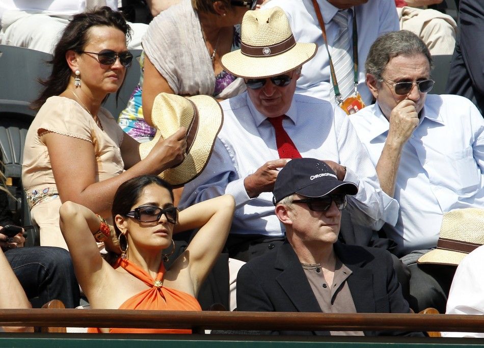 Businessman Pinault and actress Hayek attend the semi-final match between Nadal of Spain and Murray of Britain during the French Open tennis tournament at the Roland Garros stadium in Paris