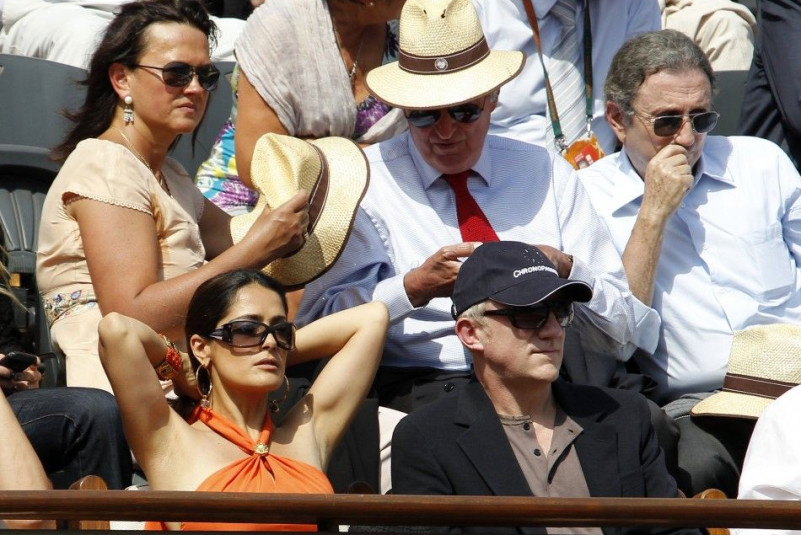 Businessman Pinault and actress Hayek attend the semi-final match between Nadal of Spain and Murray of Britain during the French Open tennis tournament at the Roland Garros stadium in Paris