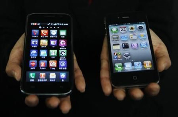A Samsung Electronics&#039; Galaxy S smartphone and an Apple Inc&#039;s iPhone 4 smartphone are seen in this picture illustration taken in Seoul