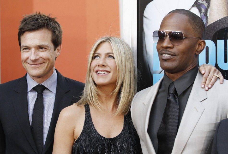 Cast members Jason Bateman, Jennifer Aniston and Jamie Foxx pose at the premiere of Horrible Bosses at the Graumans Chinese theatre in Hollywood