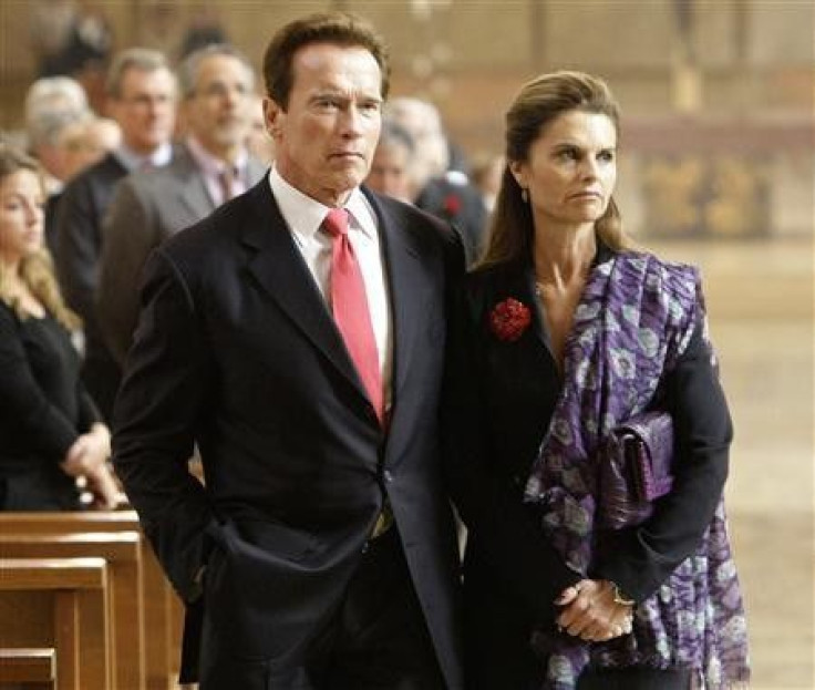 California Governor Arnold Schwarzengger and his wife Maria Shriver (R) attend funeral services for Italian film producer Dino De Laurentiis in Los Angeles