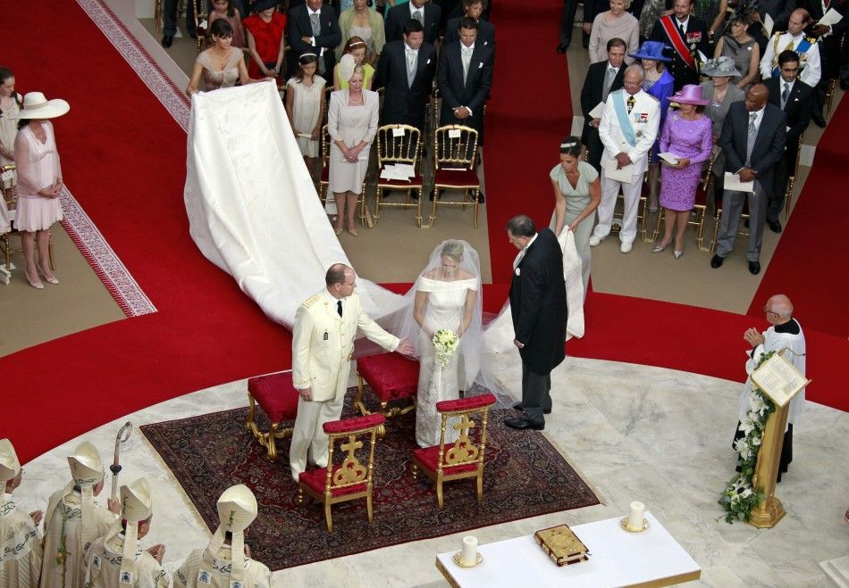  Monacos Prince Albert II takes the hand of Princess Charlene during their religious wedding ceremony at the Palace in Monaco