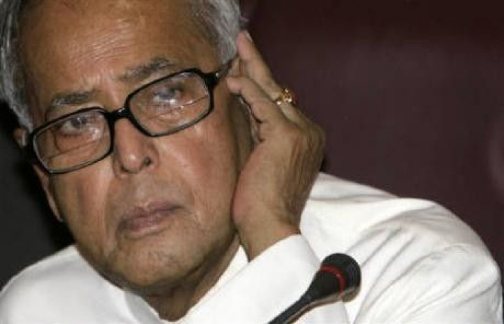 Finance Minister Pranab Mukherjee listens to a question during a news conference in New Delhi May 27, 2009. The government said on Tuesday it would seek again to reach agreement on a controversial increase in fuel prices to help improve its fiscal positio