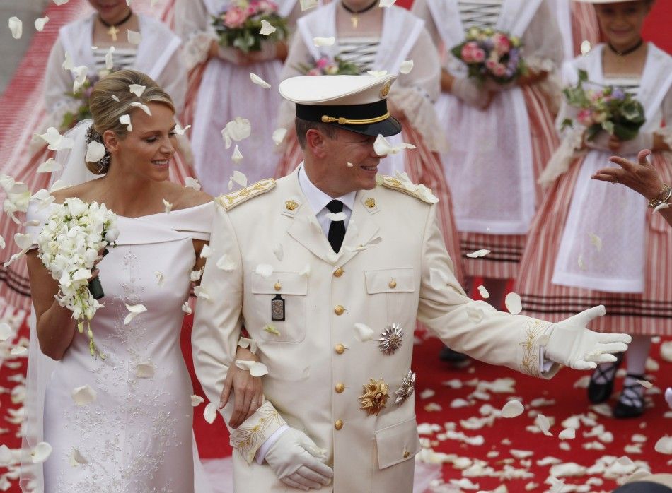 Monacos Prince Albert II and Princess Charlene leave the Palace after the religious wedding ceremony in Monaco