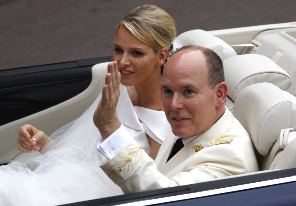 Monacos Prince Albert II and Princess Charlene leave the Palace after the religious ceremony in Monaco