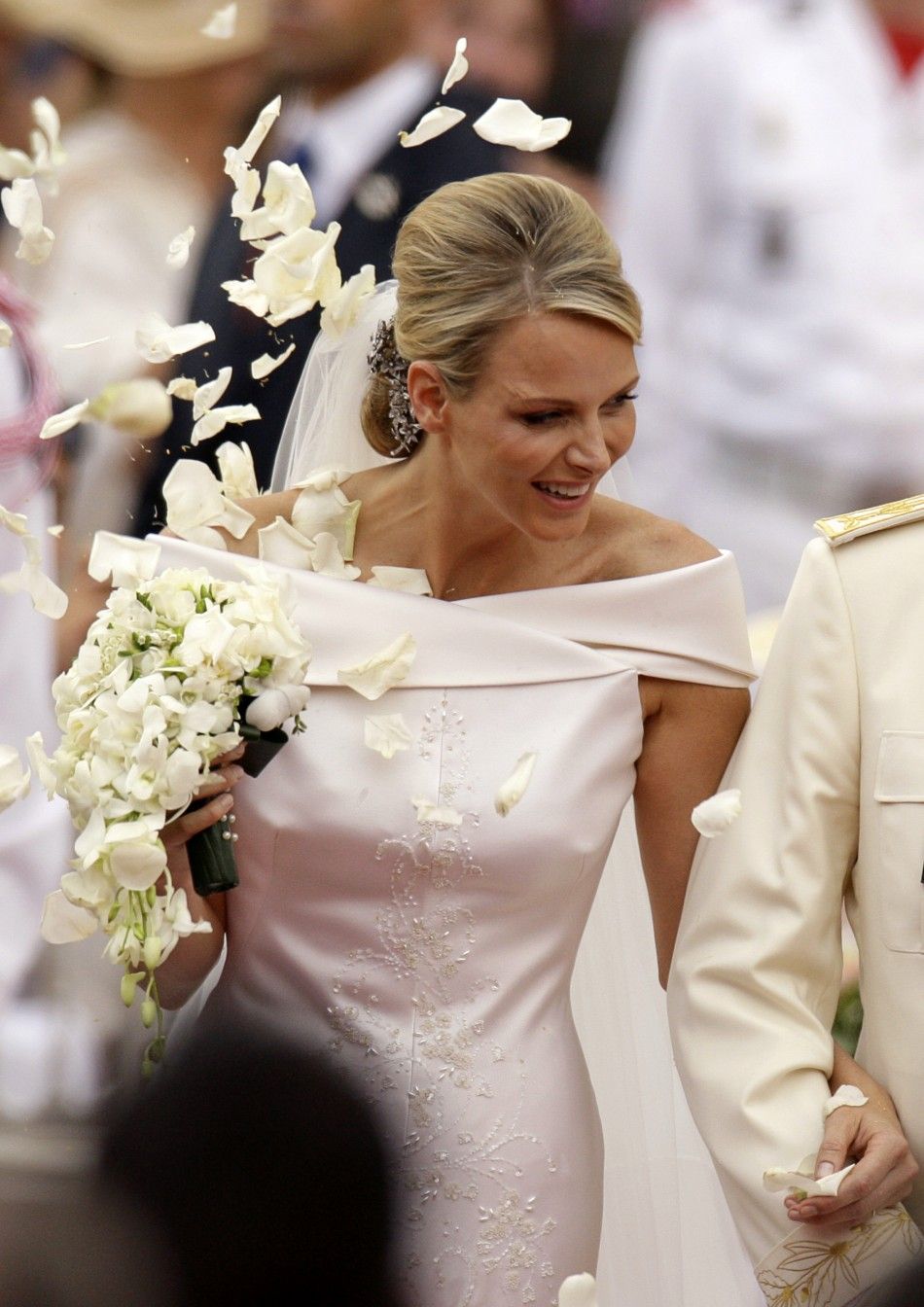 Princess Charlene of Monaco smiles as she departs from the Monaco palace after their religious wedding ceremony in Monaco