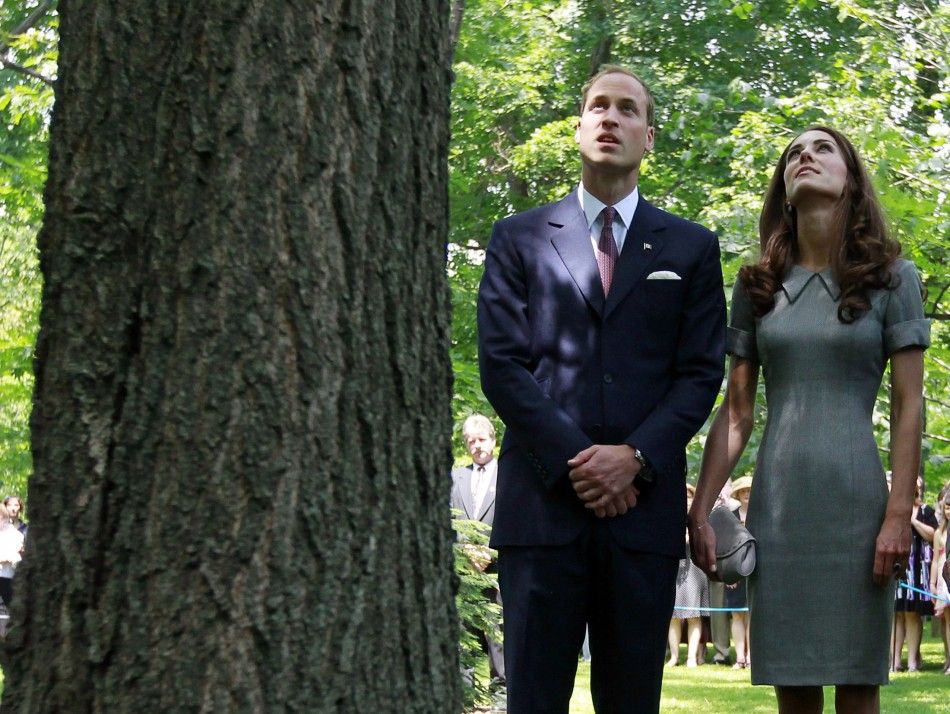 William and Kate quietly reflect at a tree planted by Diana