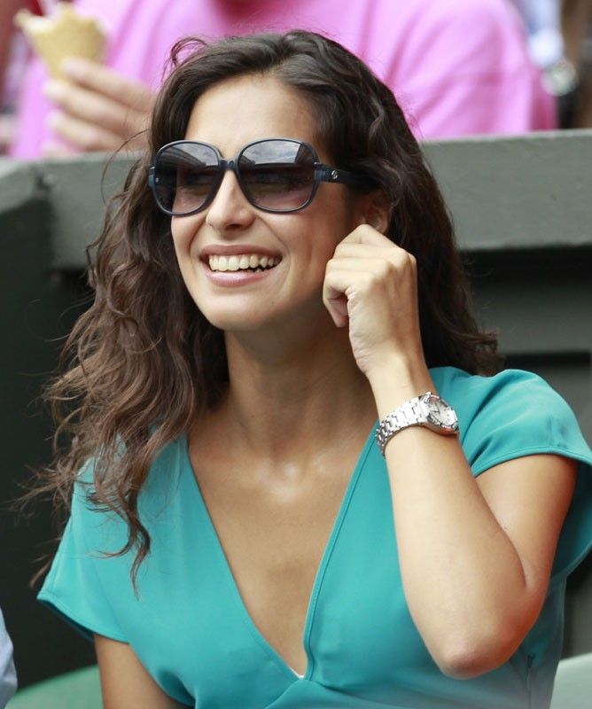 The girlfriend of Rafael Nadal of Spain Maria Francisca Perello, sits on Centre Court