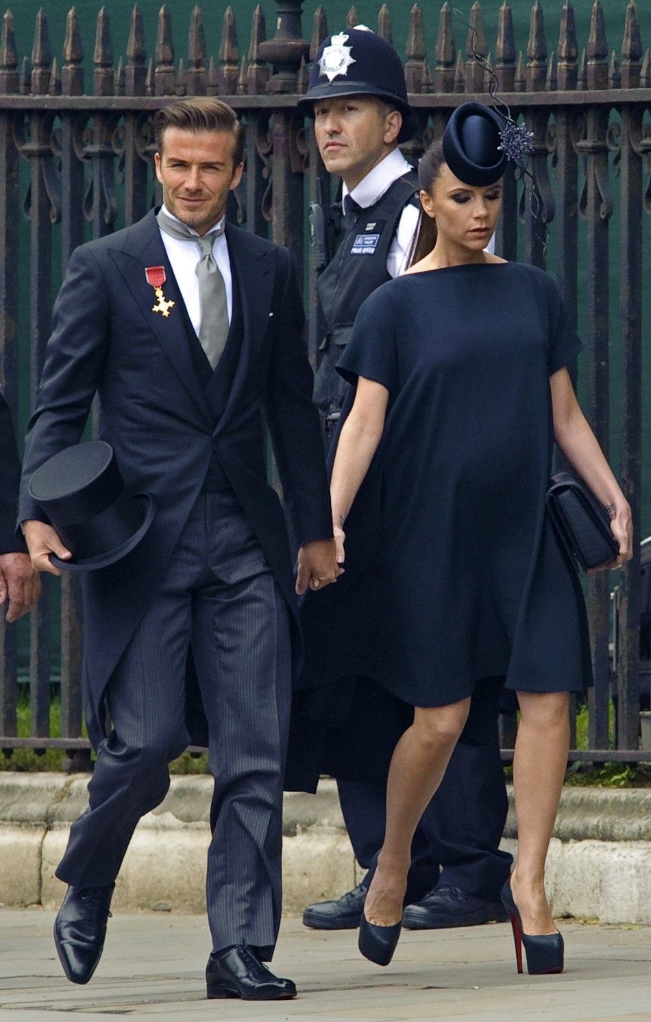 British soccer player David Beckham and his wife Victoria arrive at Westminster Abbey before the wedding of Britains Prince William and Kate Middleton, in central London