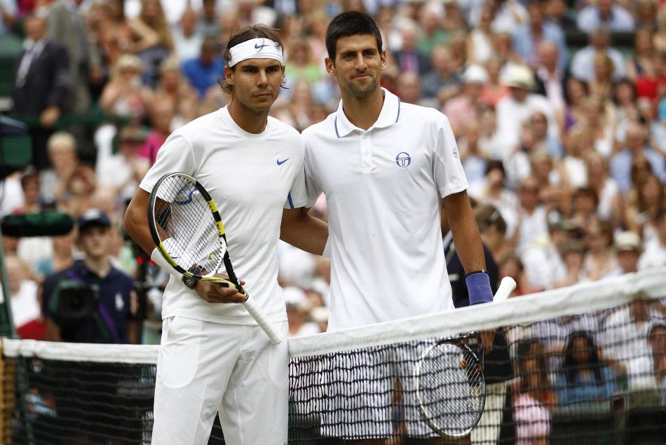 Rafael Nadal of Spain and Novak Djokovic of Serbia pose for a photograph on Centre Court before their men039s singles final match at the Wimbledon tennis championships in London.