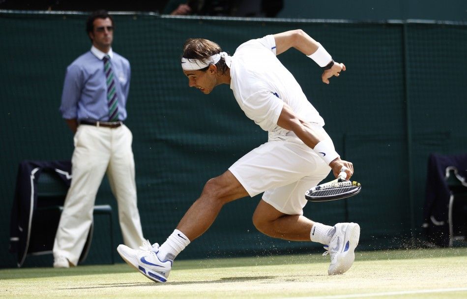 Rafael Nadal of Spain hits a return to Novak Djokovic of Serbia during their men039s singles final match at the Wimbledon tennis championships in London.