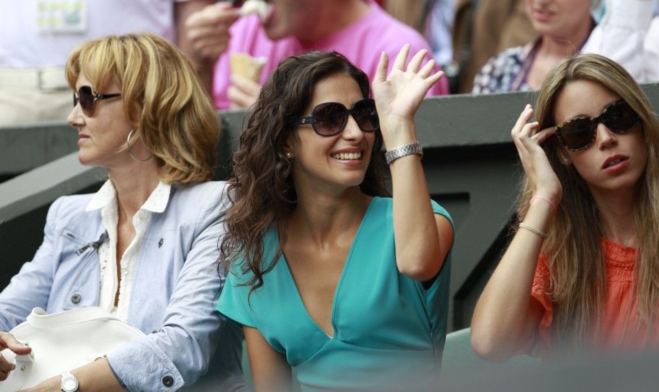 The mother of Rafael Nadal of Spain, his sister and his girlfriend sit on Centre Court for Nadal039s match against Novak Djokovic of Serbia at the Wimbledon tennis championships in London