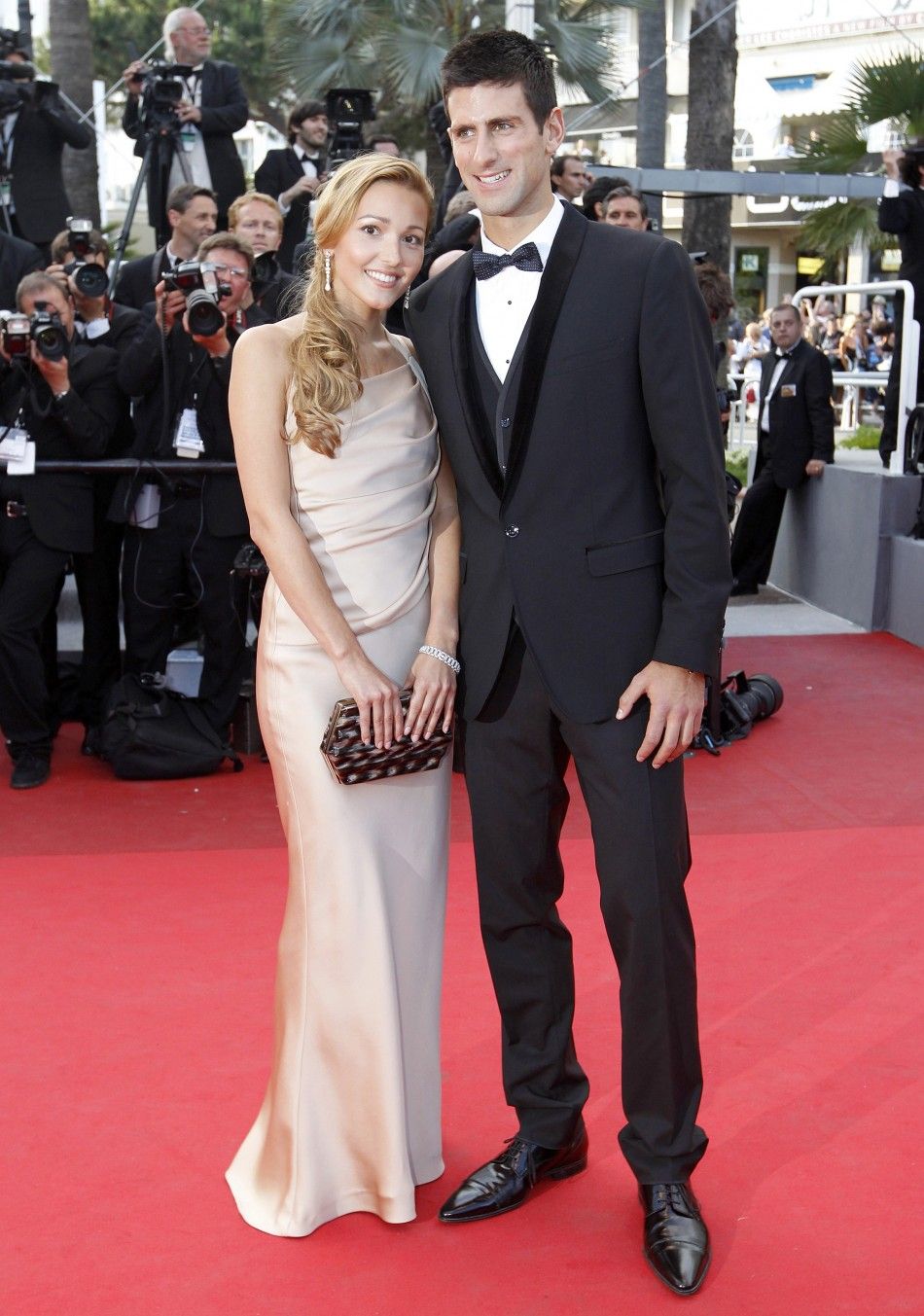 Tennis player Djokovic and girlfriend Ristic arrive on the red carpet for the screening of the film The Beaver at the 64th Cannes Film Festival